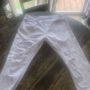 White fitted jeans, high waisted.